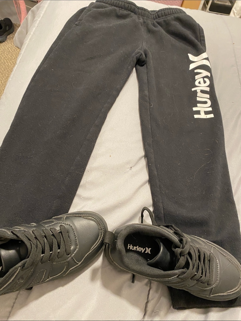 BHurley Black Sweatpants with White Vertical Logo and Hurley black sneakers